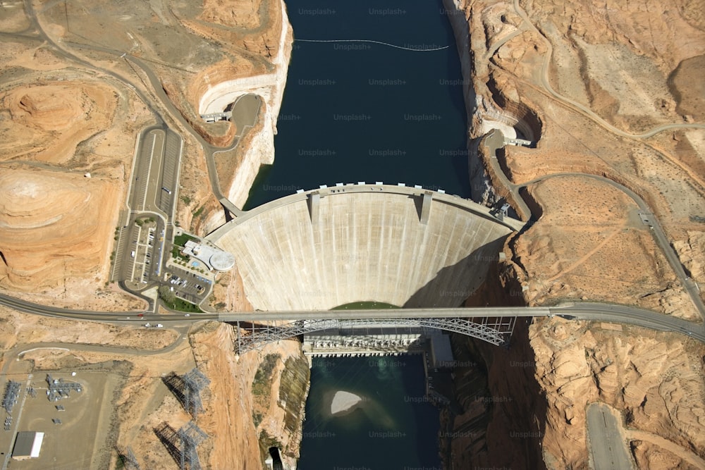 an aerial view of a dam and a bridge