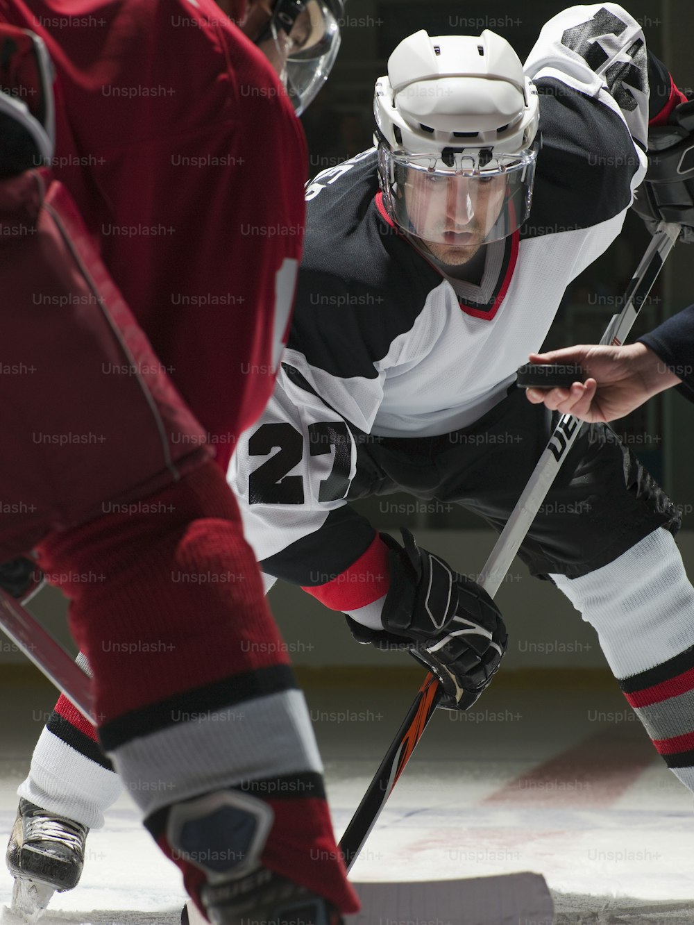 a hockey player in a black and white uniform