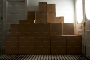 a stack of cardboard boxes sitting on top of a checkered floor
