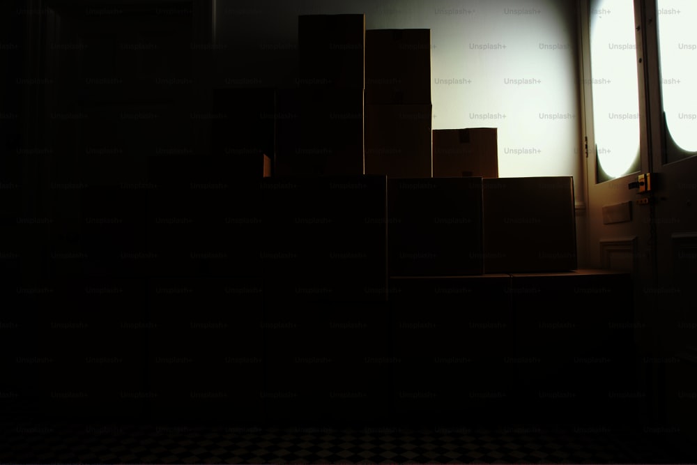 a stack of cardboard boxes sitting on top of a checkered floor