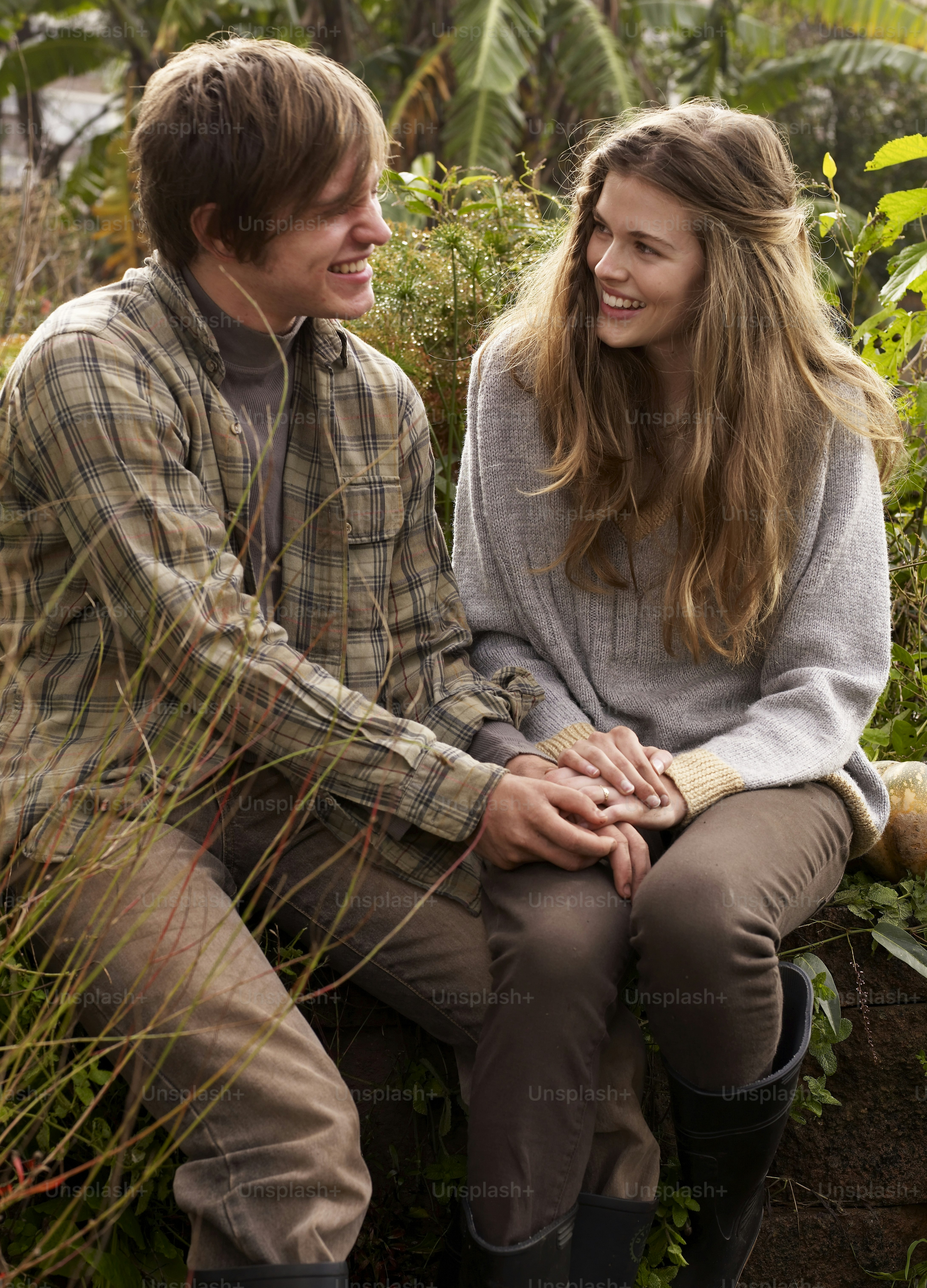 a man and a woman sitting next to each other