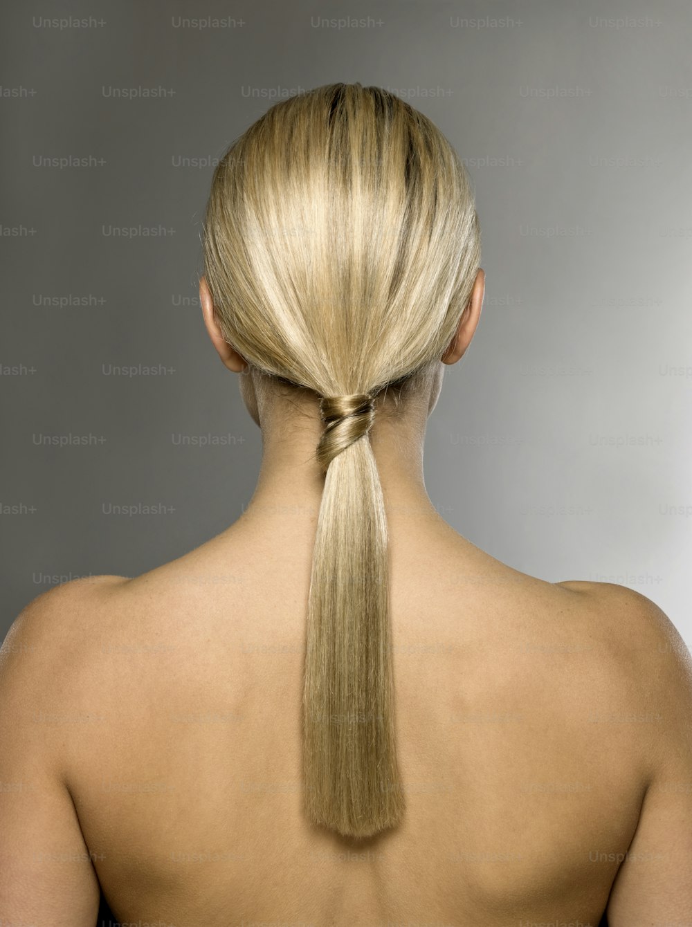 a woman with a ponytail in her hair