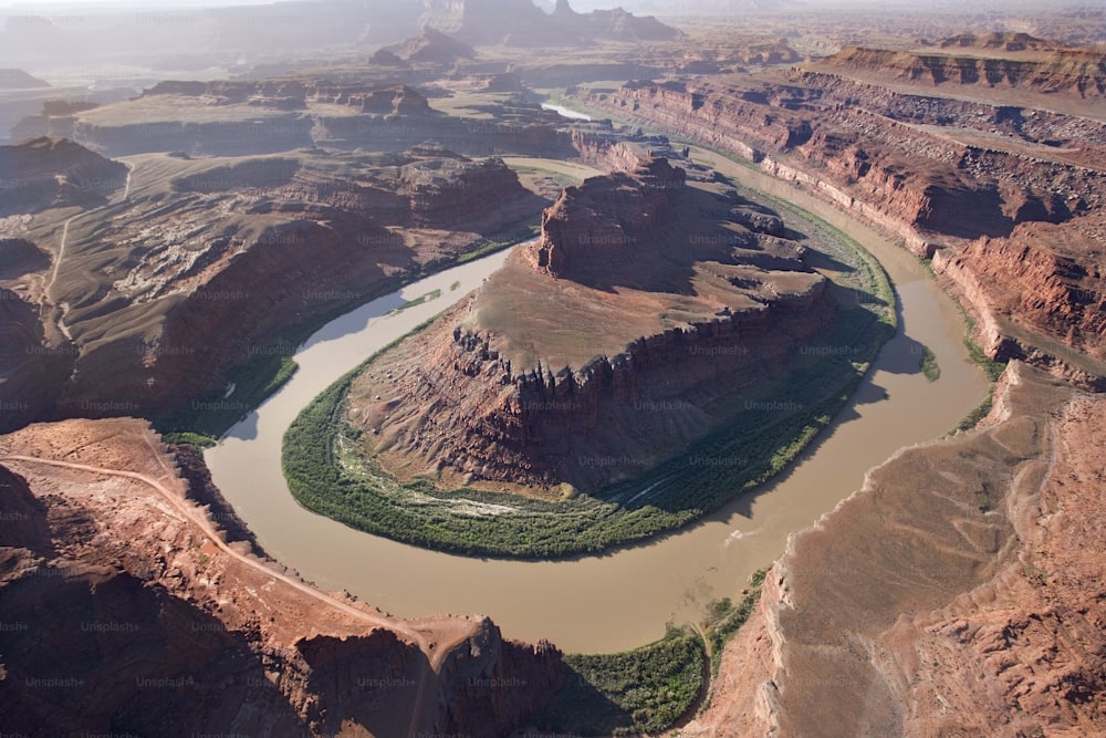 an aerial view of a river surrounded by mountains