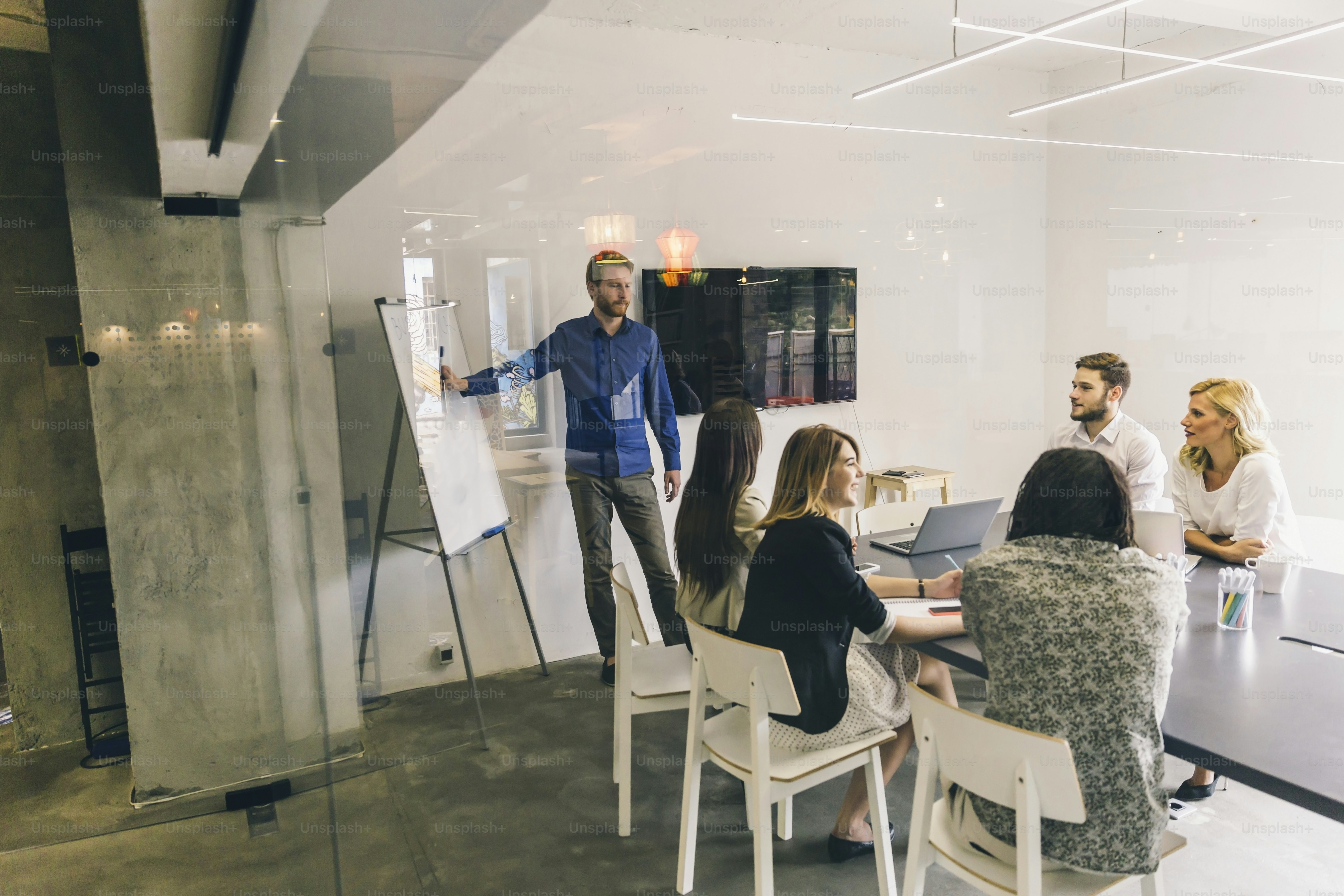 Group of coworkers at an office brainstorming and presentation