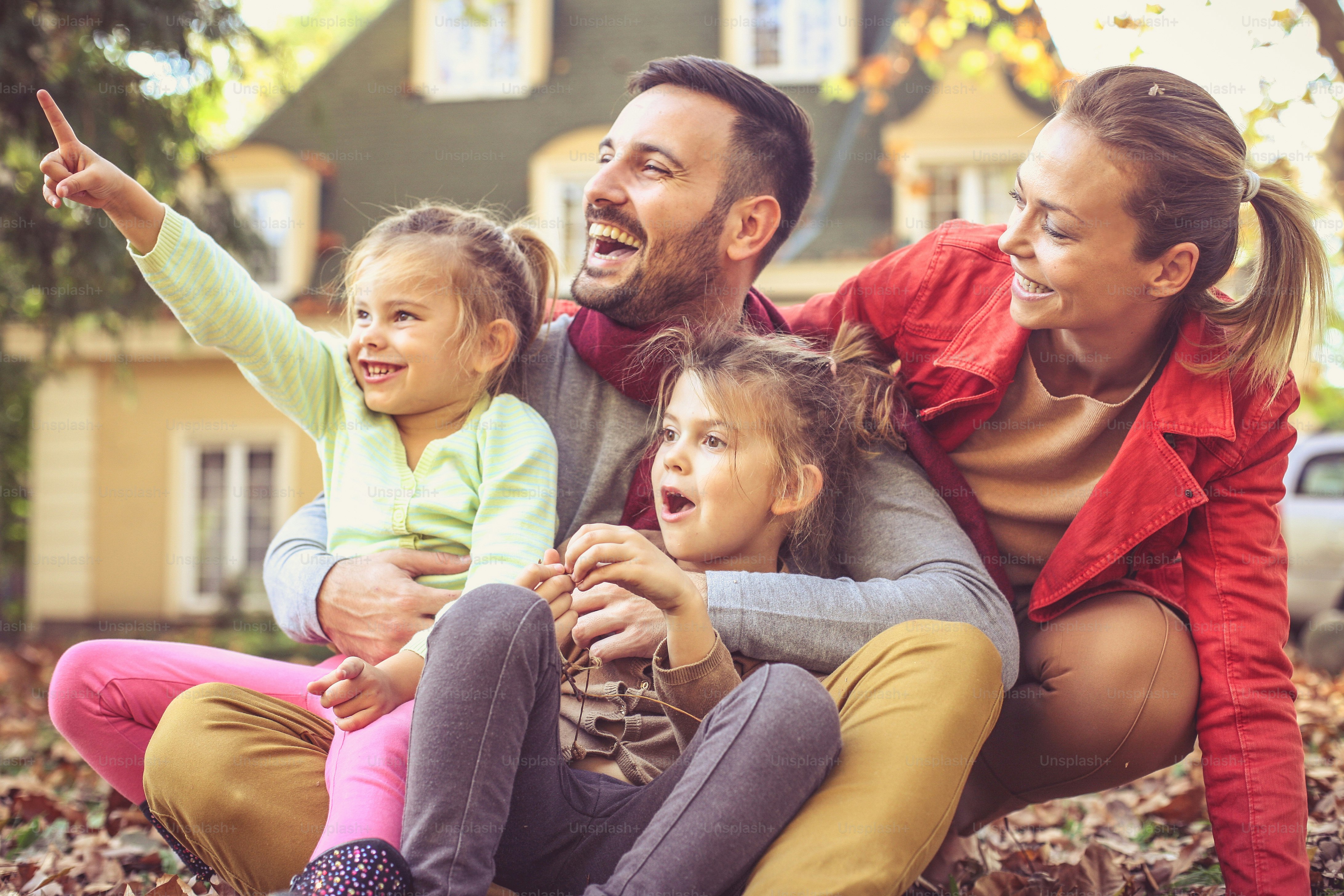 Smiling happy family have fun outside.