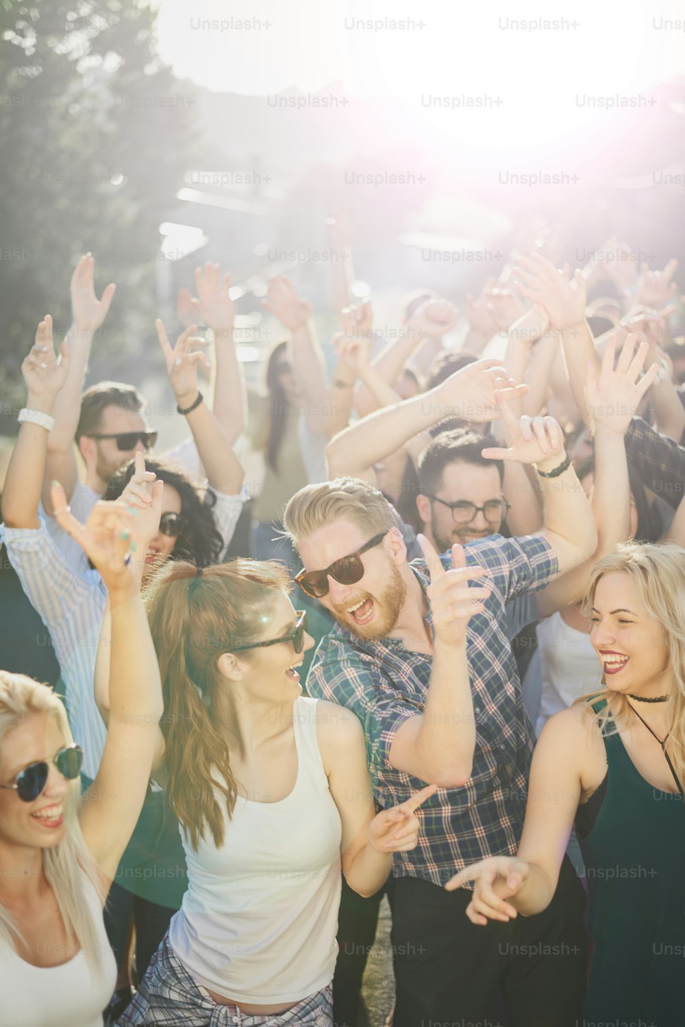 Group of people dancing at outdoor party