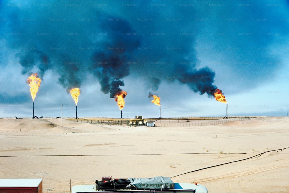 a truck is parked in front of a large fire