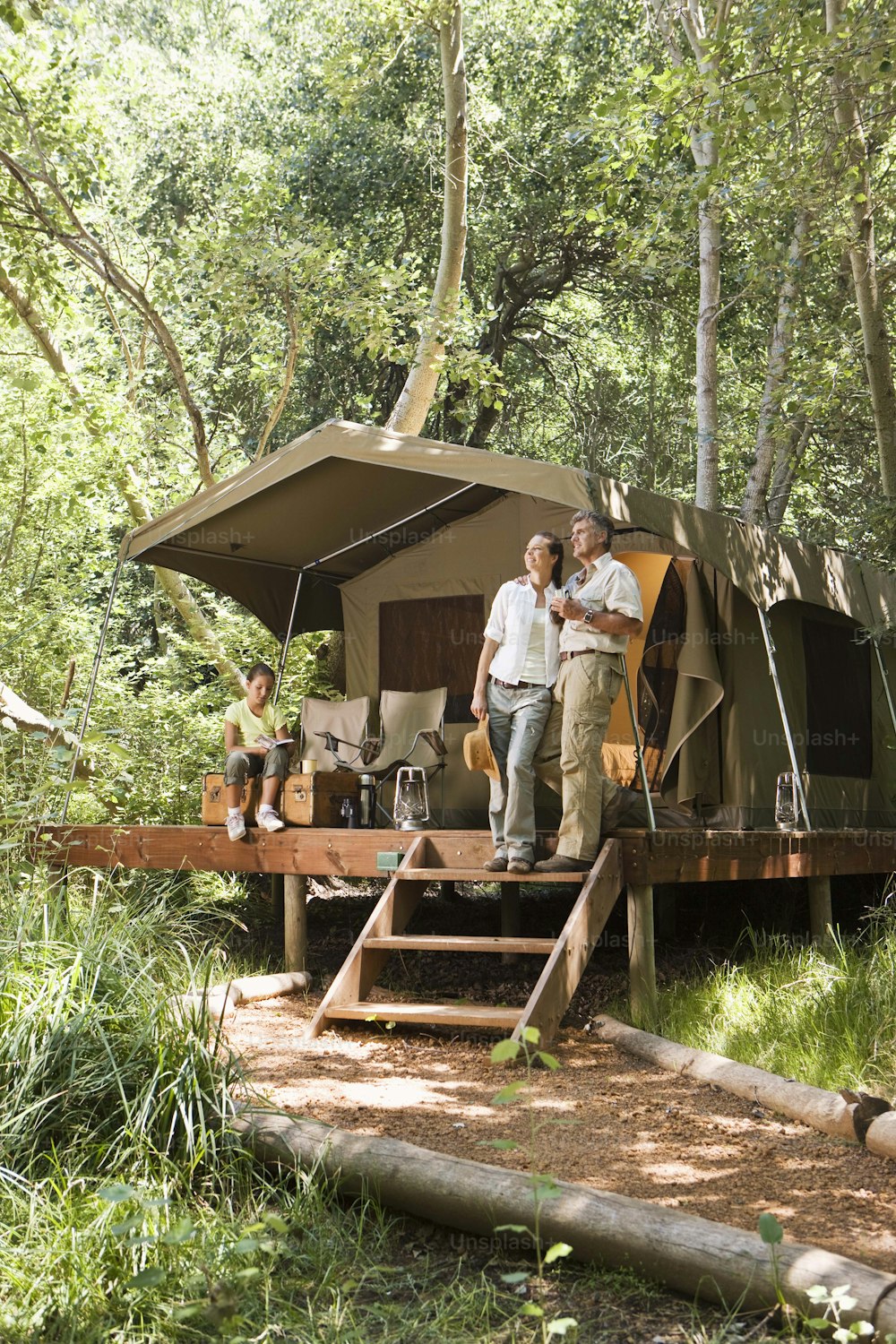 a couple of men standing on top of a wooden platform