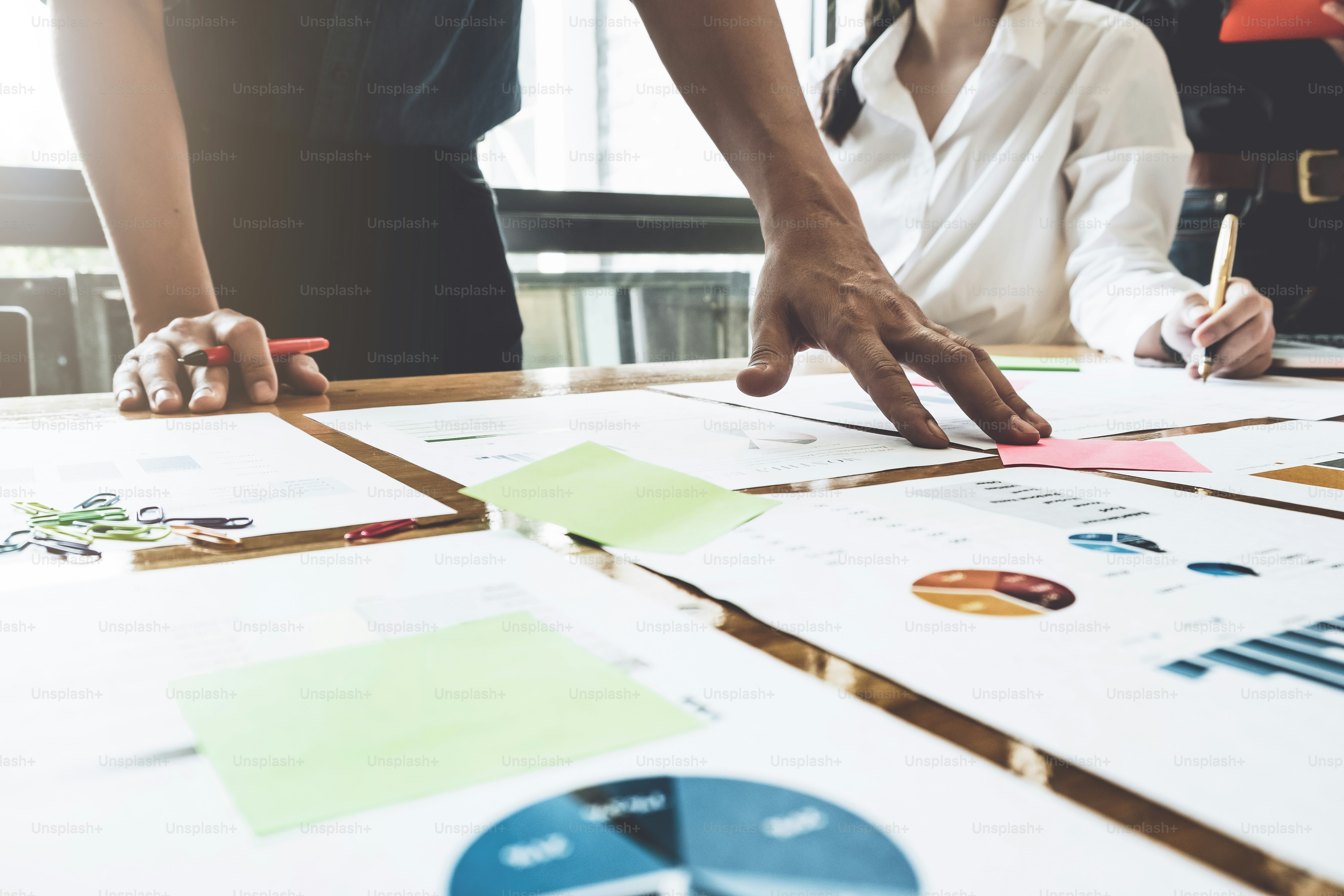 Business Team Meeting Strategy Marketing from business financial document. Business group Concept