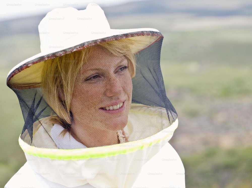 a woman wearing a bee suit and a hat