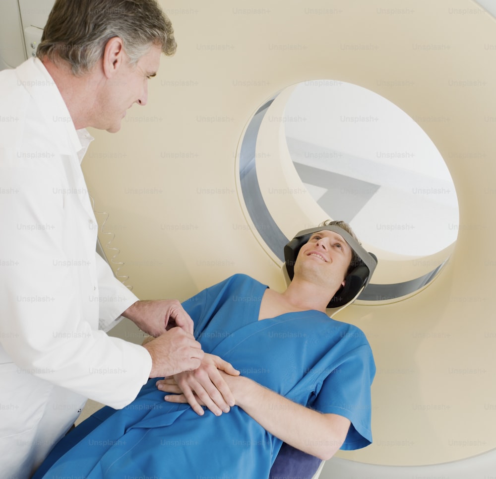a woman in a blue dress being examined by a doctor