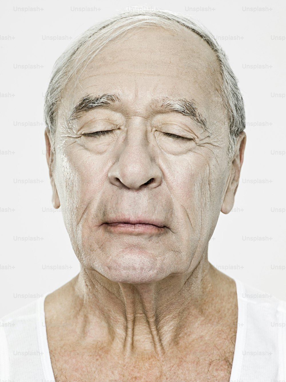 an older man with wrinkles on his face