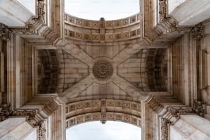 Low-angle view of the triumphal arch in Rua Augusta in Lisbon, built to commemorate the city’s reconstruction after the 1755 earthquake.