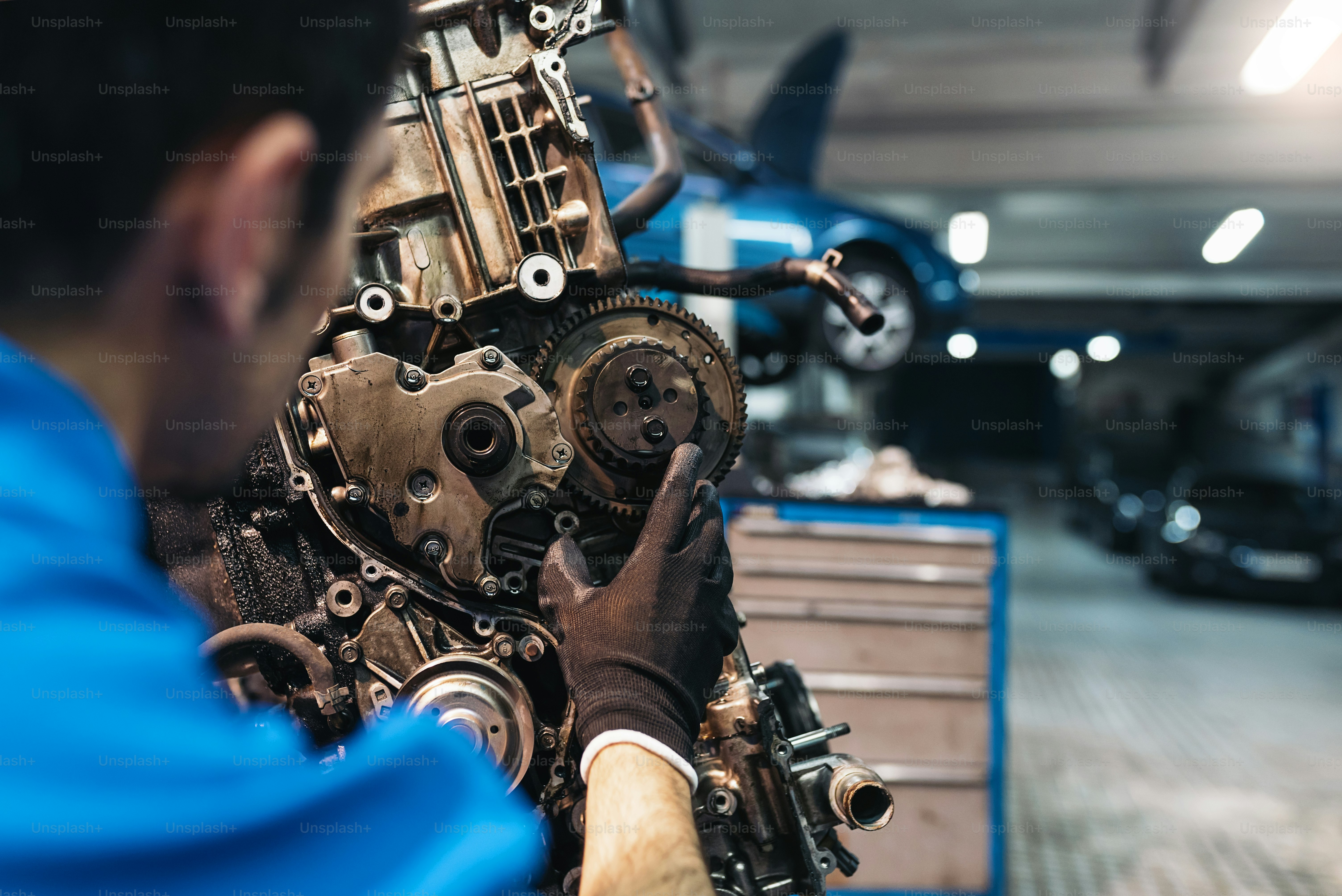 Professional Mechanic Repairing Car Engine in Garage