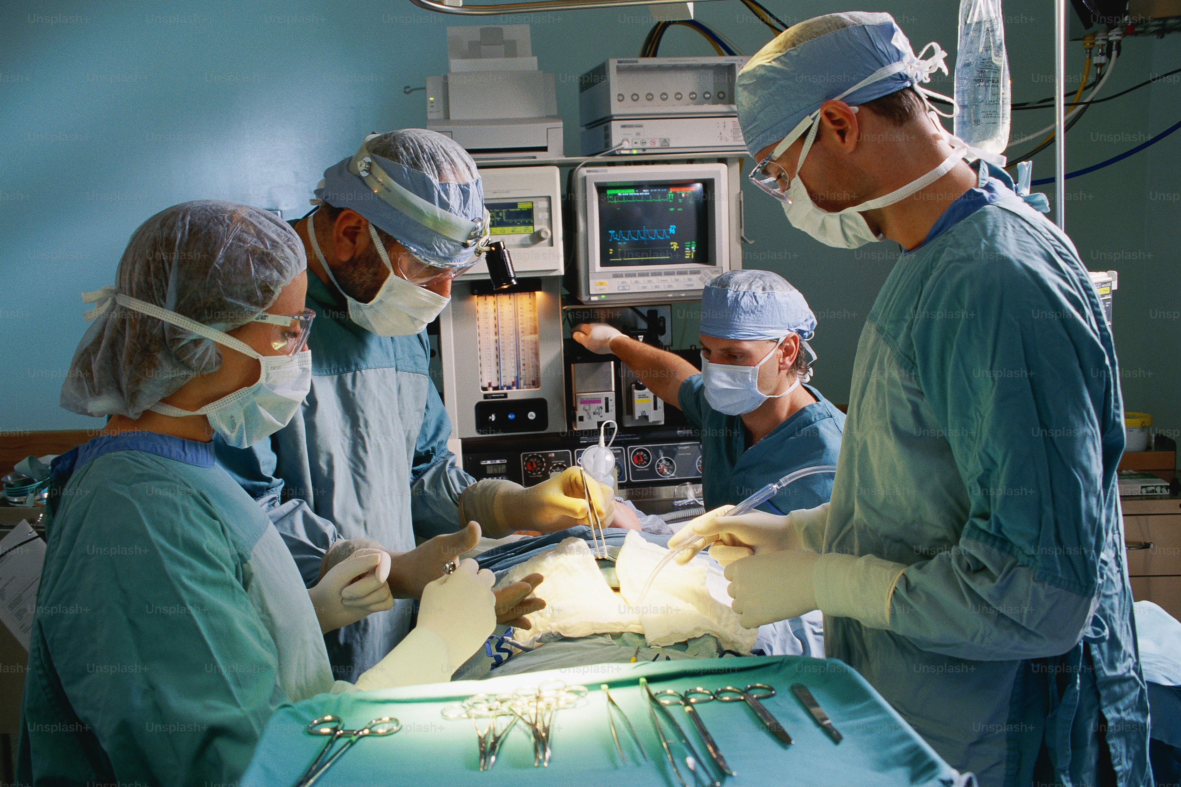 a group of doctors performing surgery in a hospital