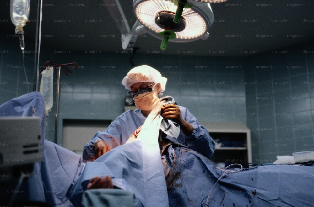 a person in a hospital operating on a machine