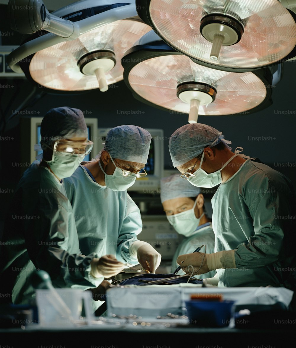 a group of surgeons in a operating room