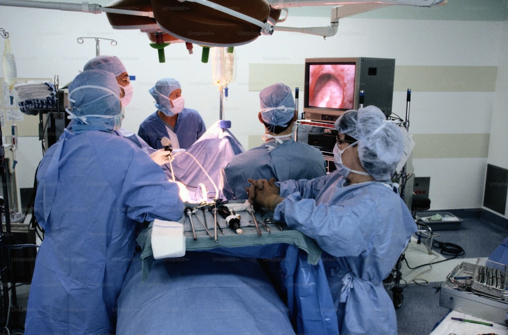 a group of doctors performing surgery in a hospital