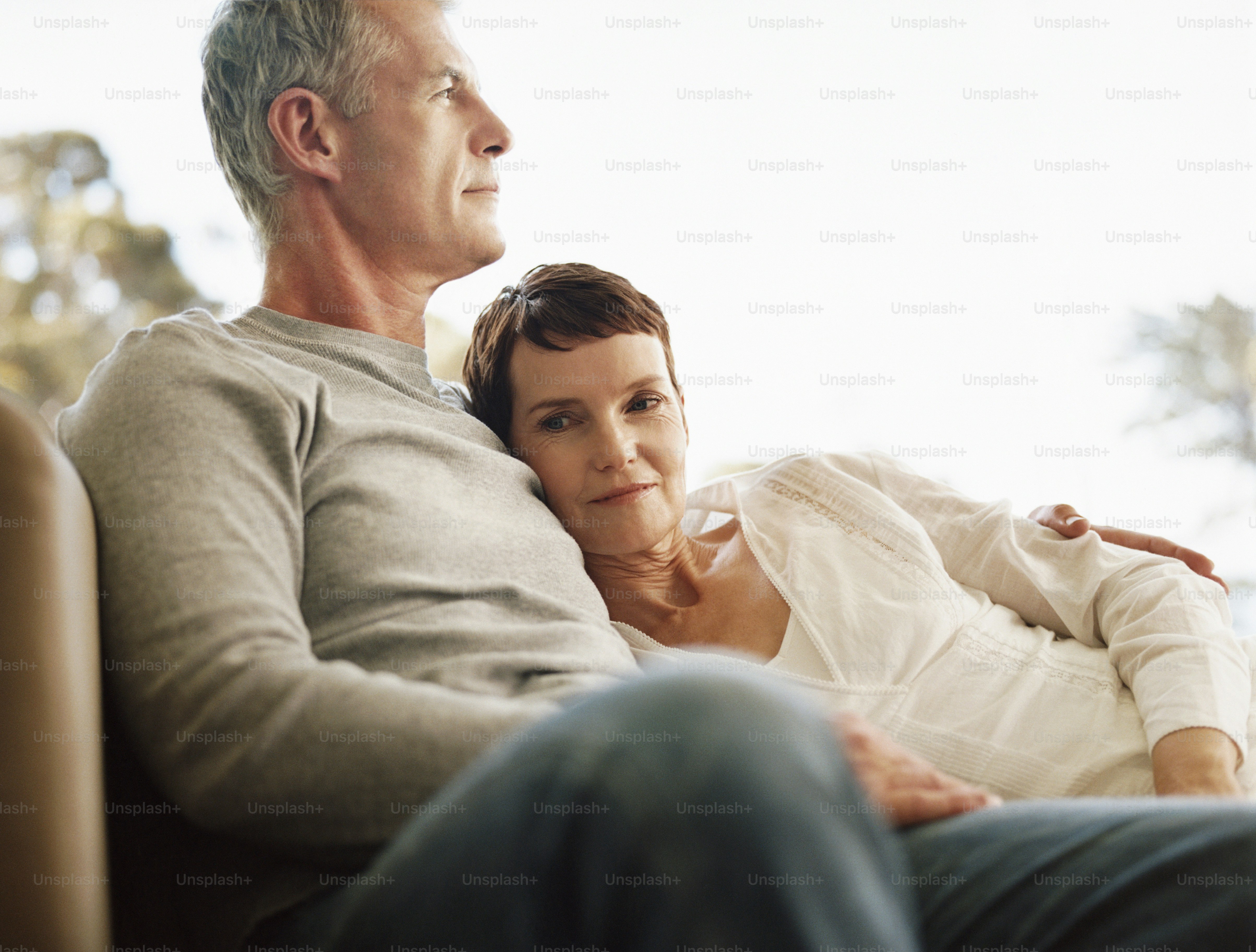 a man and a woman sitting on a couch