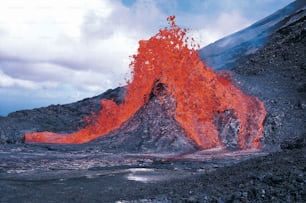 a volcano with lava spewing out of it