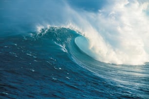 a large wave in the middle of the ocean