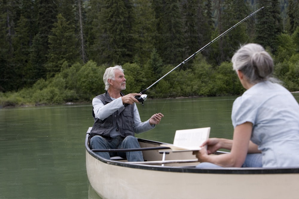 a man and a woman fishing in a boat