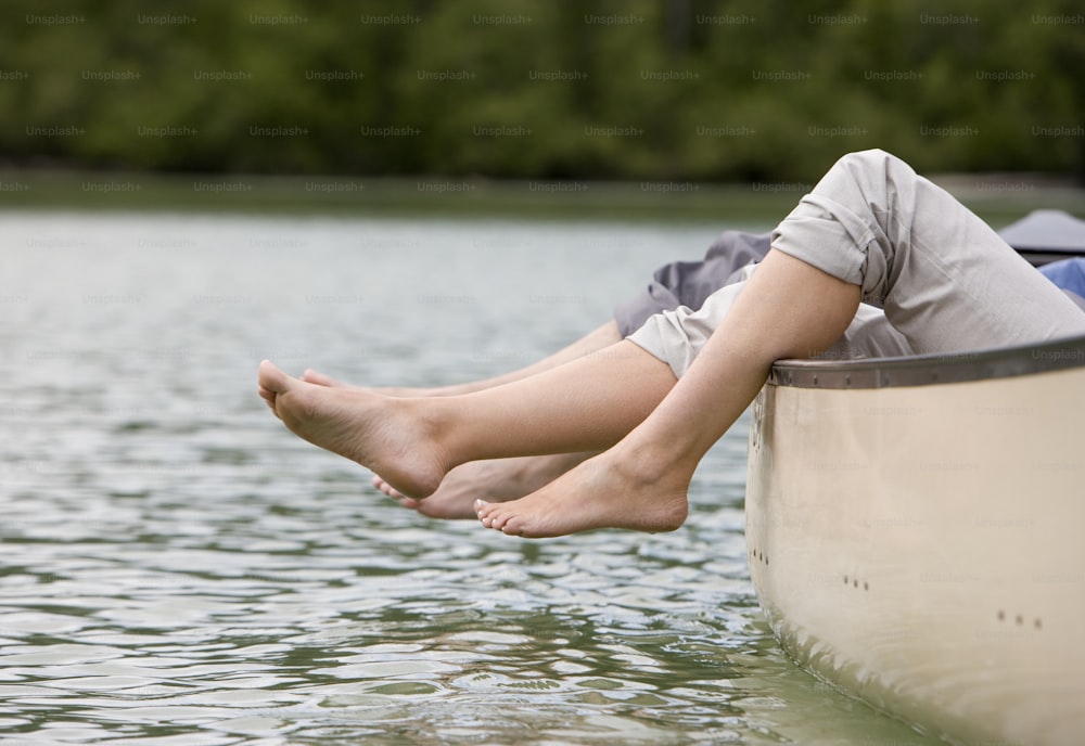 a person sitting on a boat in the water