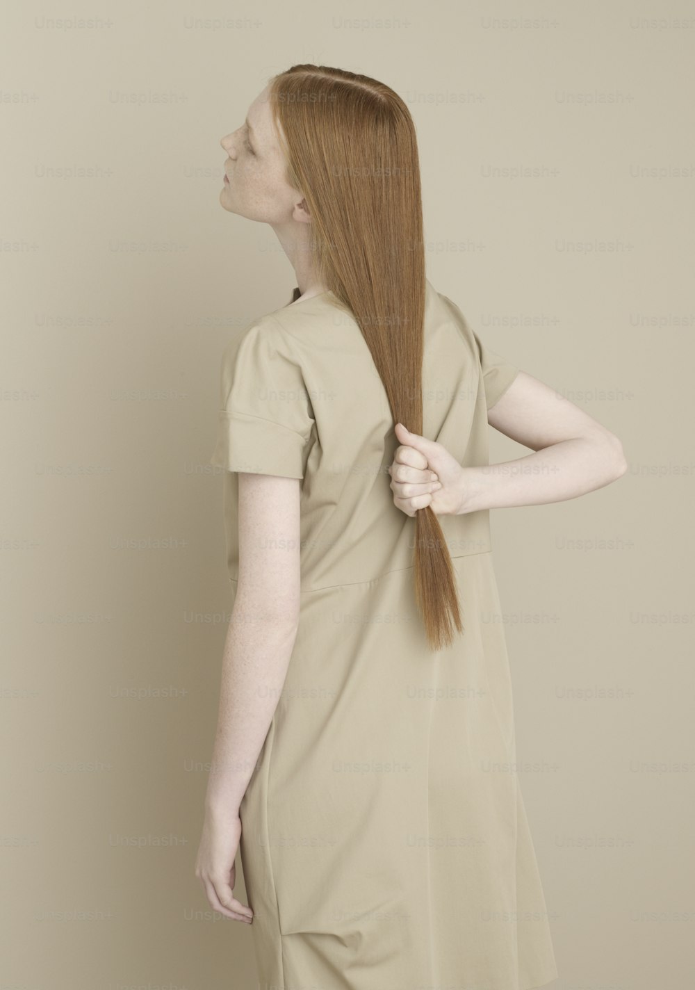 a woman with long red hair in a dress