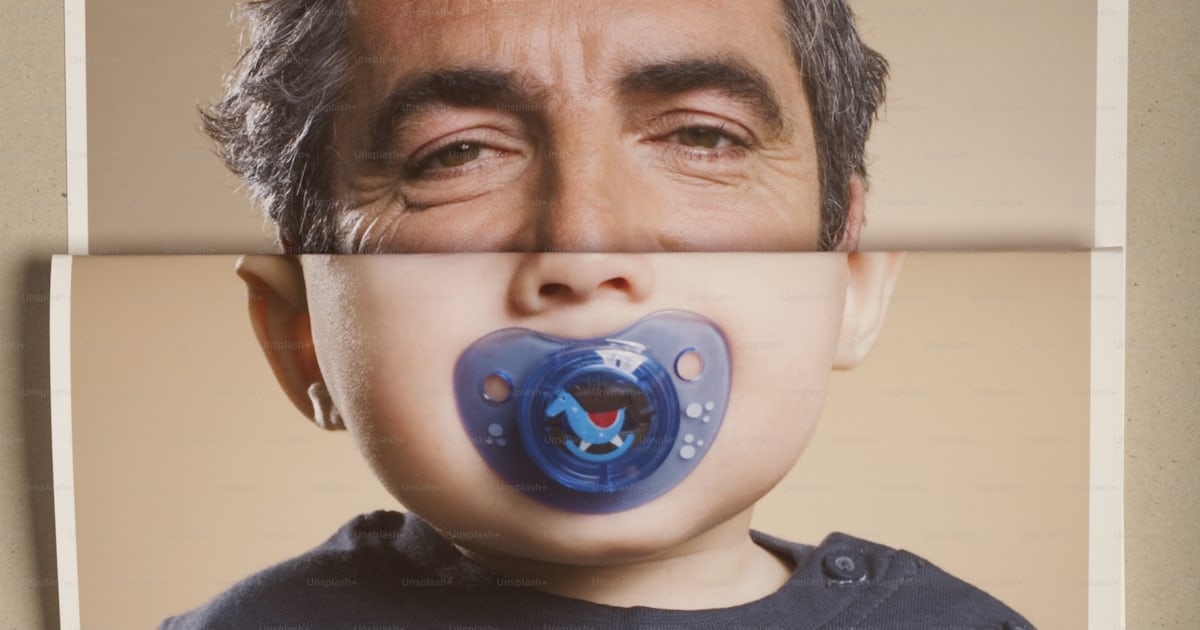 A man with a pacifier in his mouth photo – Photography Image on Unsplash
