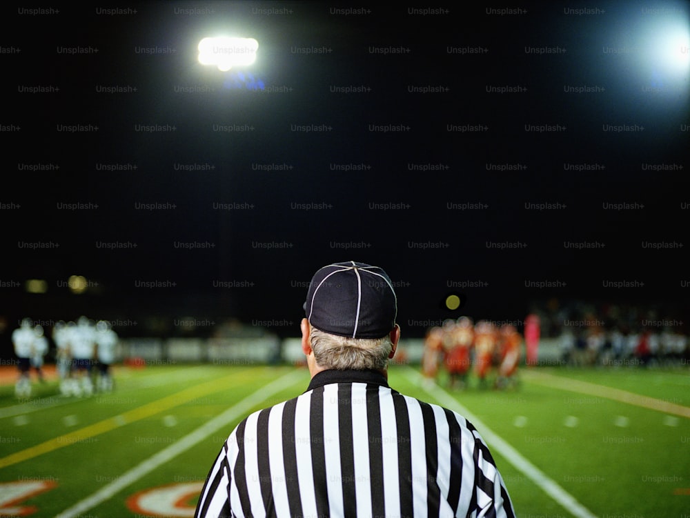 Referee Holding Up A Red Card And Whistle Inside A Stadium Stock Photo -  Download Image Now - iStock
