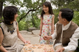 a man and a little girl playing a board game