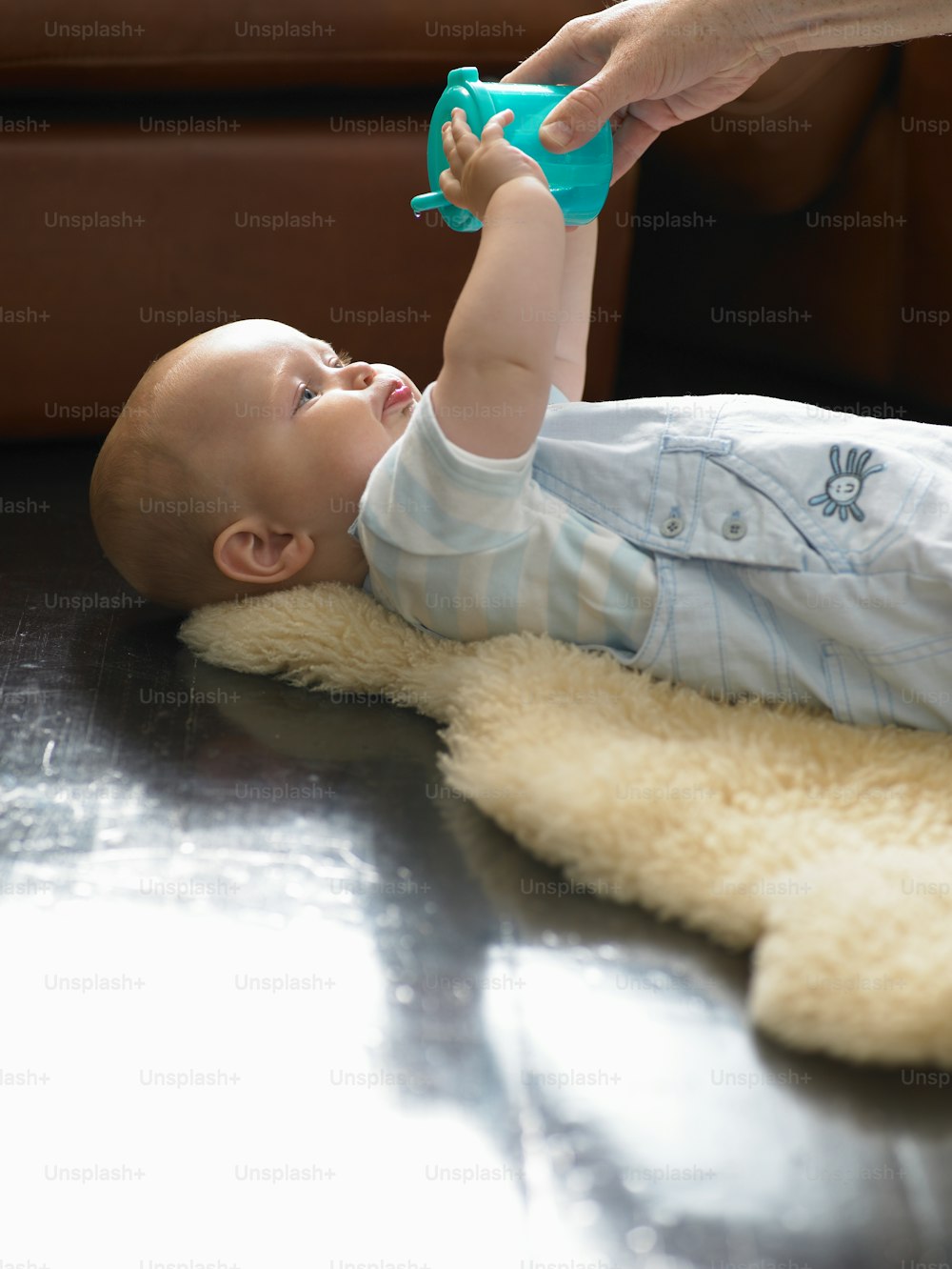 a baby is playing with a toy on the floor