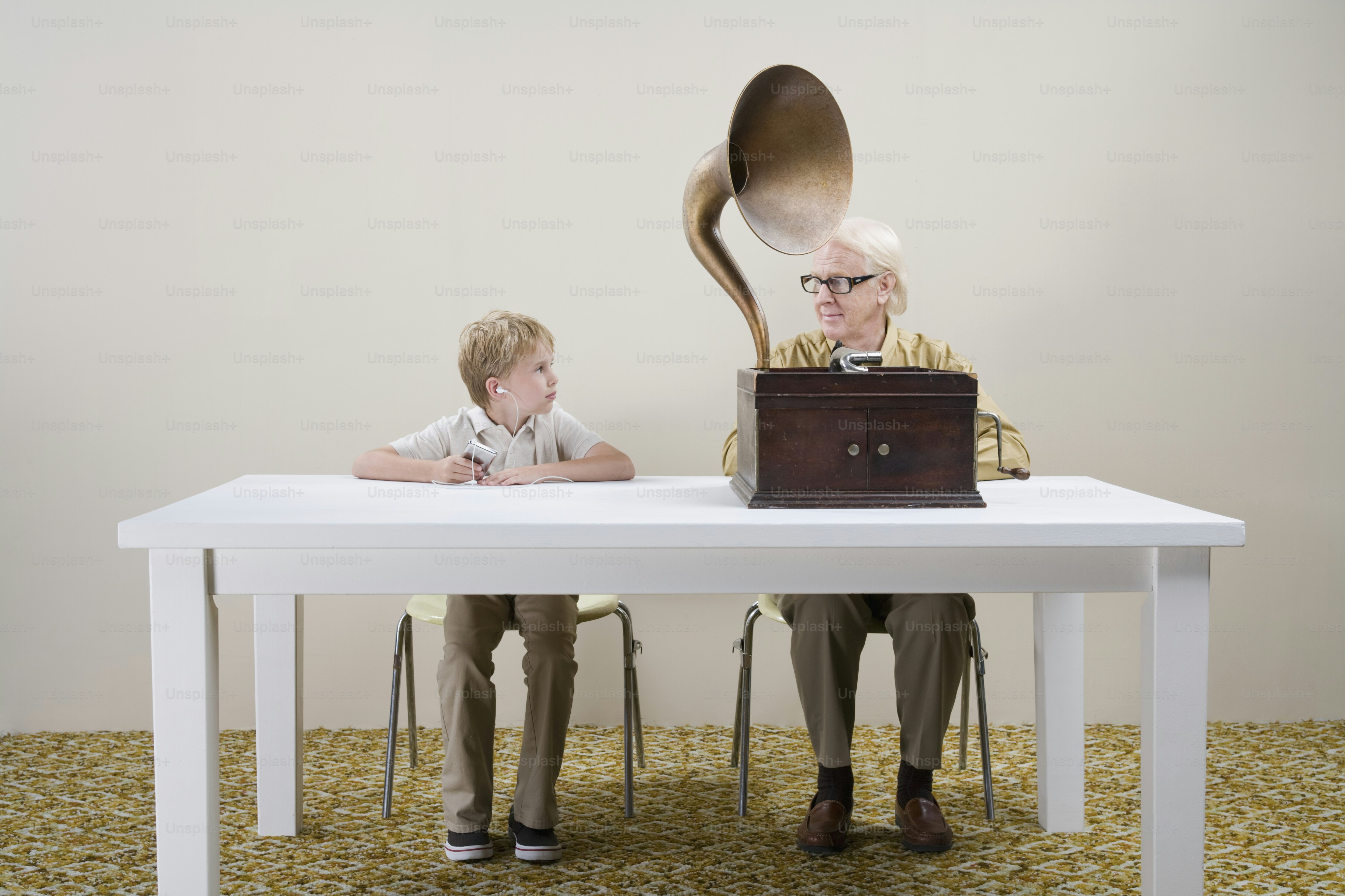 a man and a boy sitting at a table