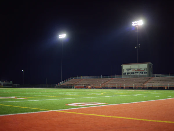 Atlanta stadium - an empty football field at night with lights on