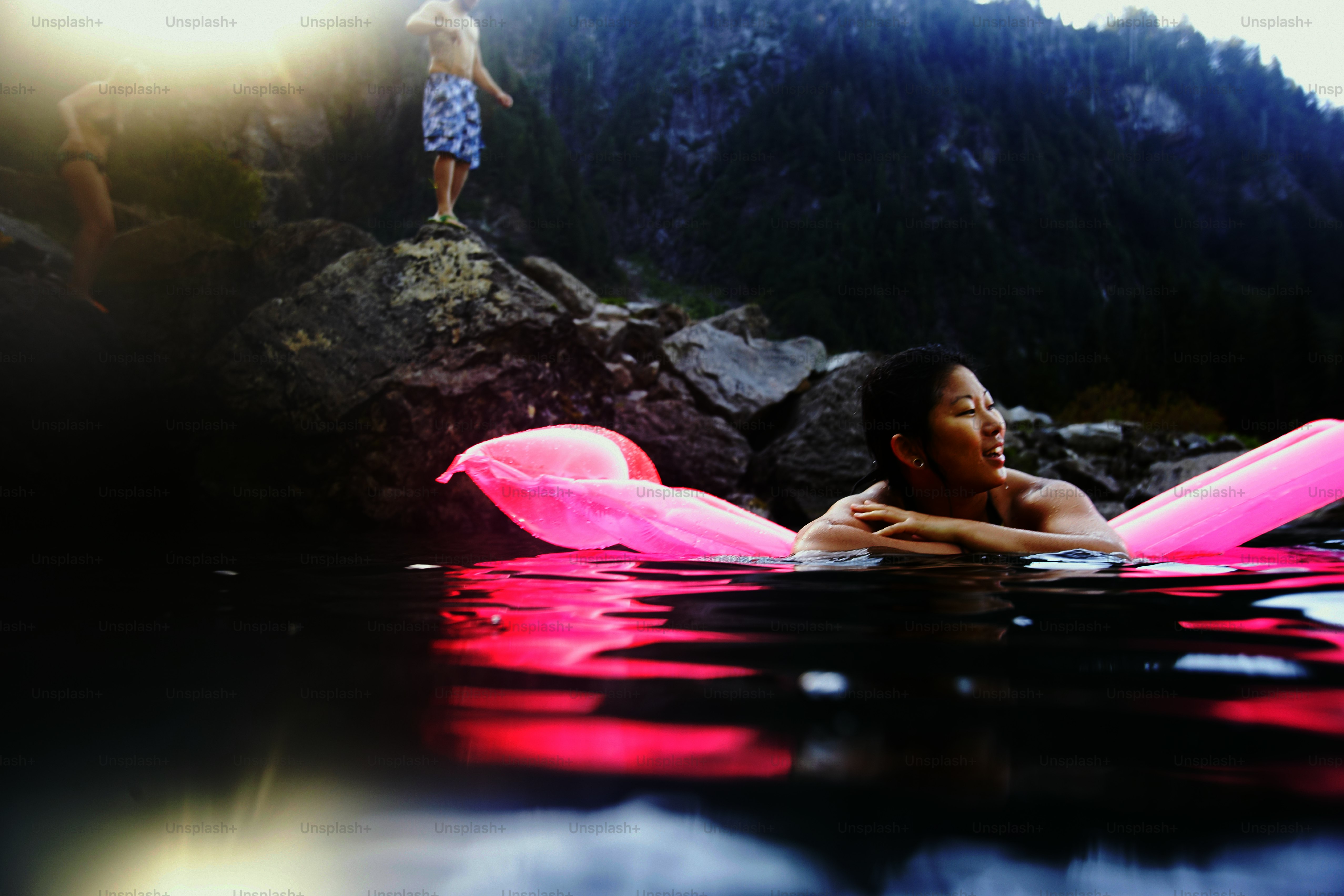 a woman floating on top of a body of water