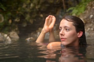 a woman floating in a pool of water