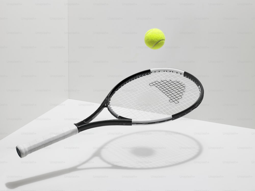 a tennis racket hitting a tennis ball