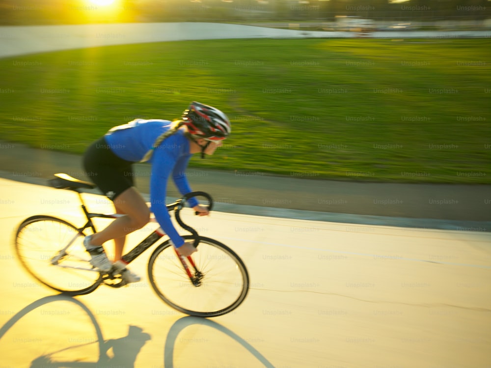 a person riding a bike down a street