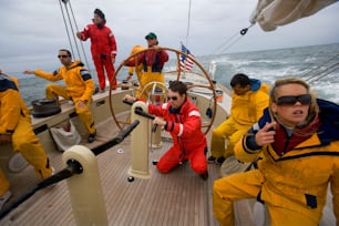 a group of people on a boat in the water