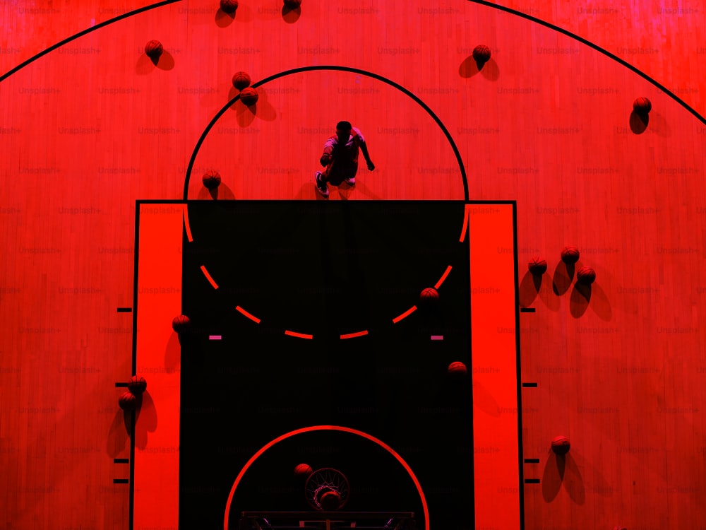 a man standing on top of a basketball court