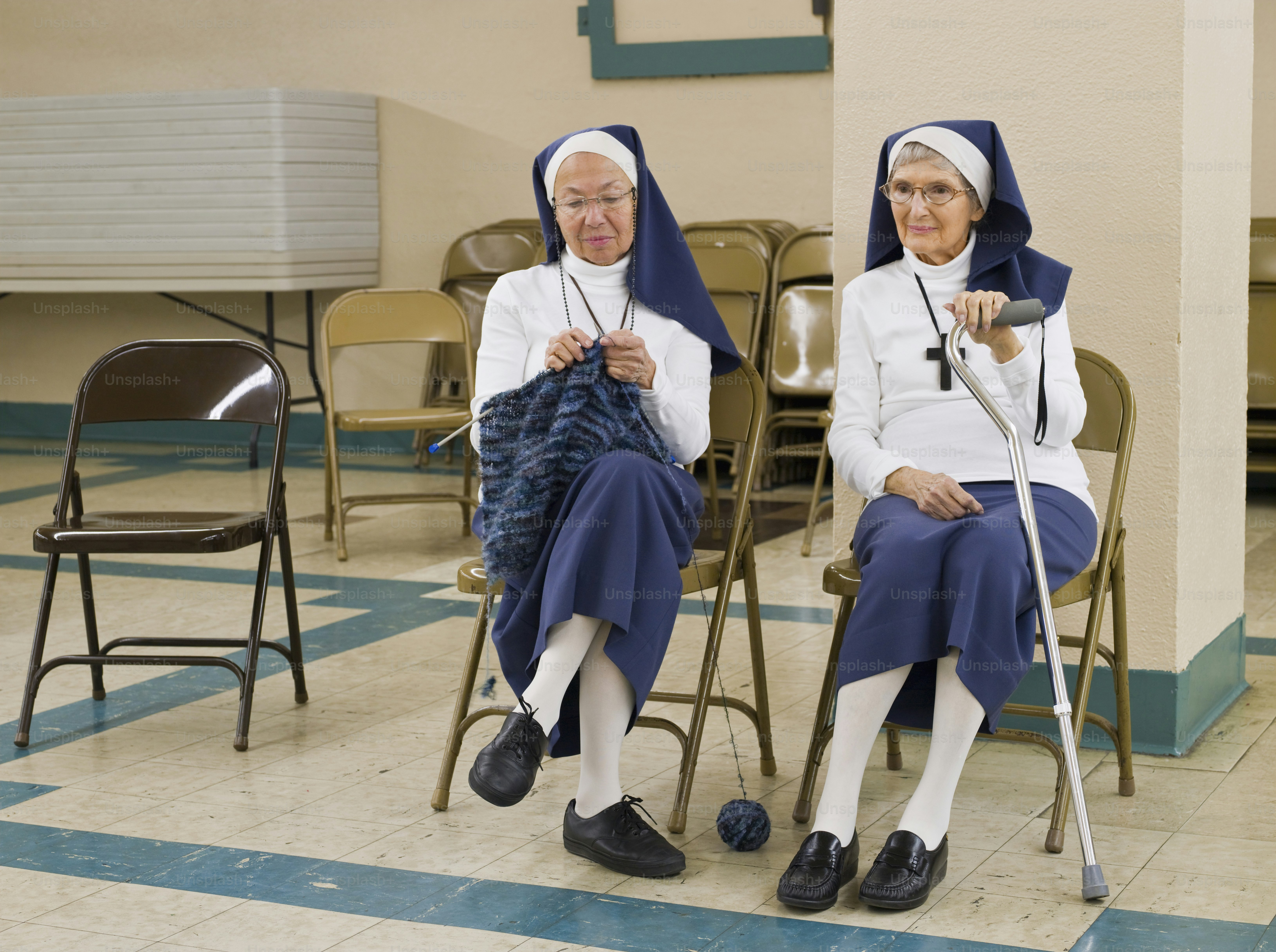 a couple of women sitting next to each other