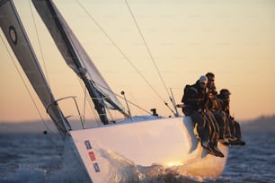 a group of people riding on the back of a boat