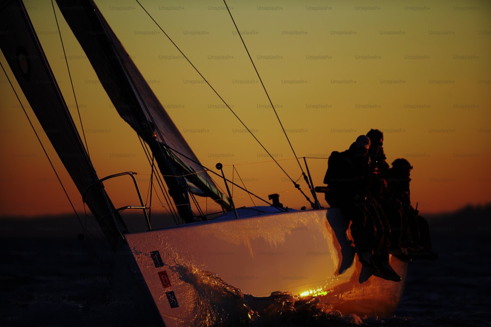 a group of people riding on the back of a boat