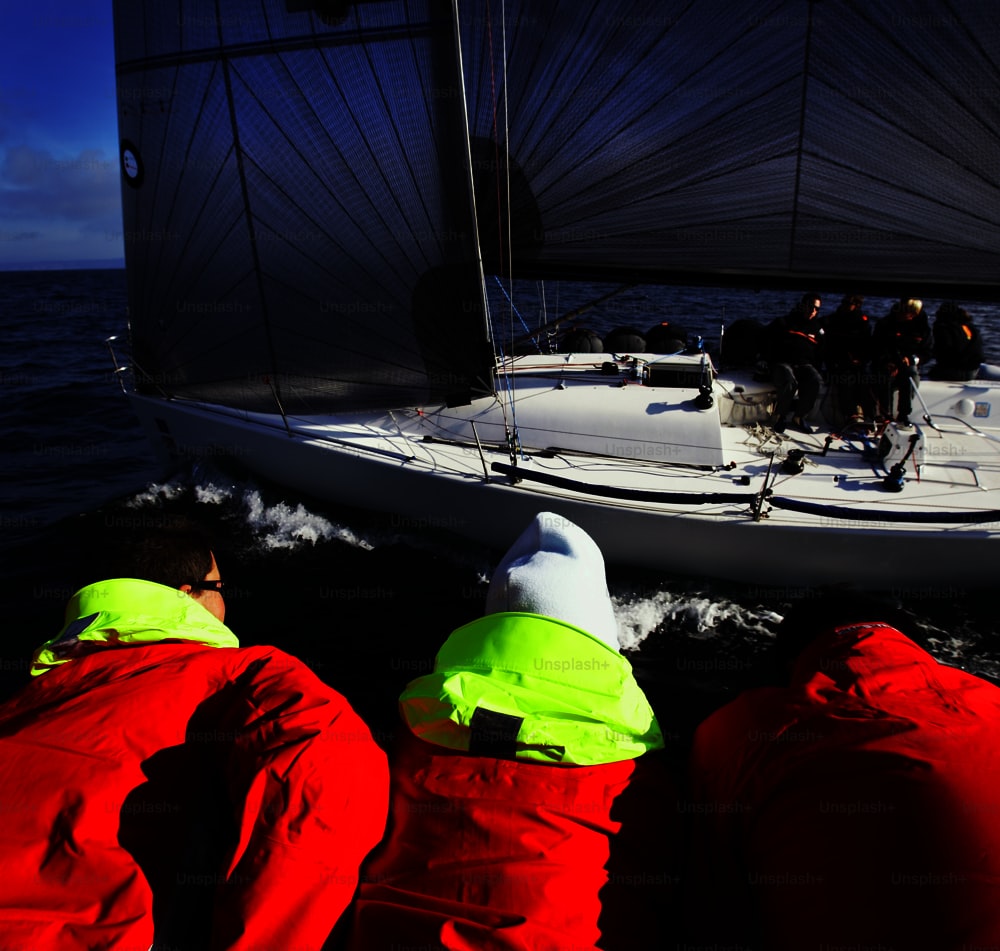 a group of people on a boat in the water