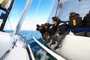 a group of people riding on the back of a boat