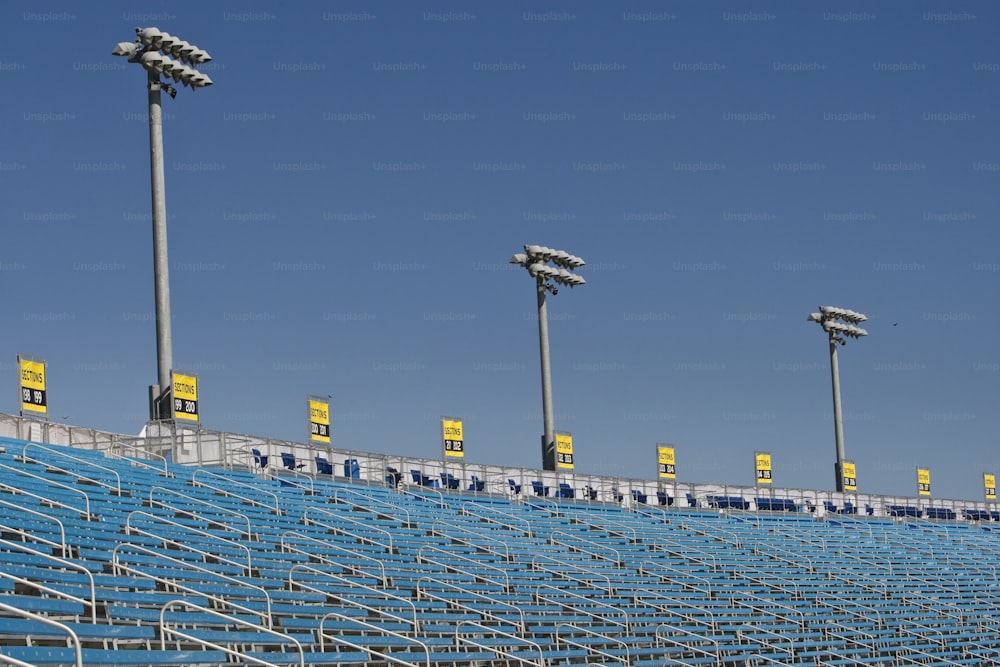 a row of blue seats sitting next to each other