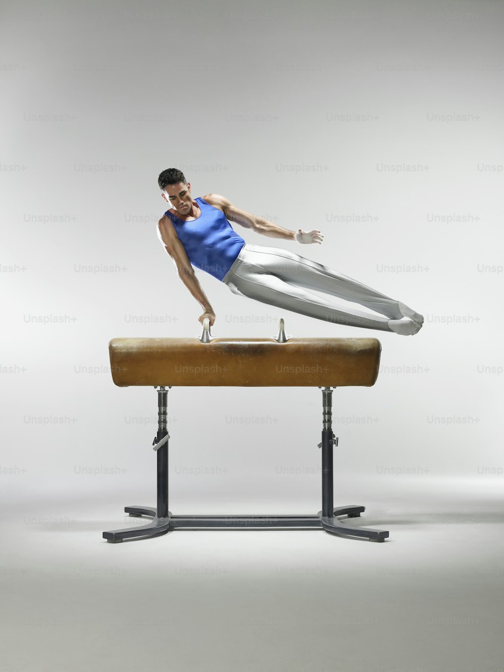 a man is balancing on a balance beam