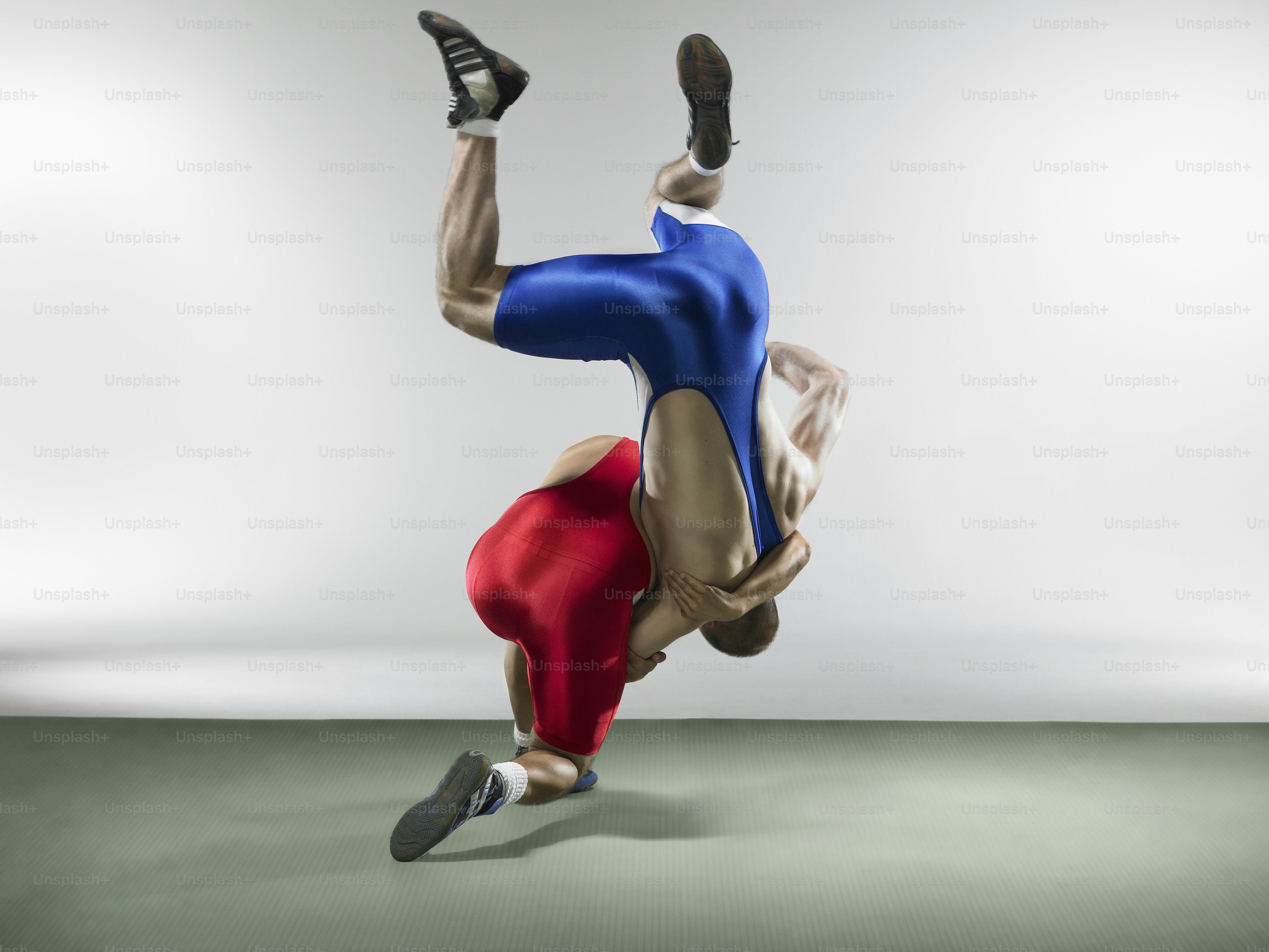 a man is doing a handstand on his feet