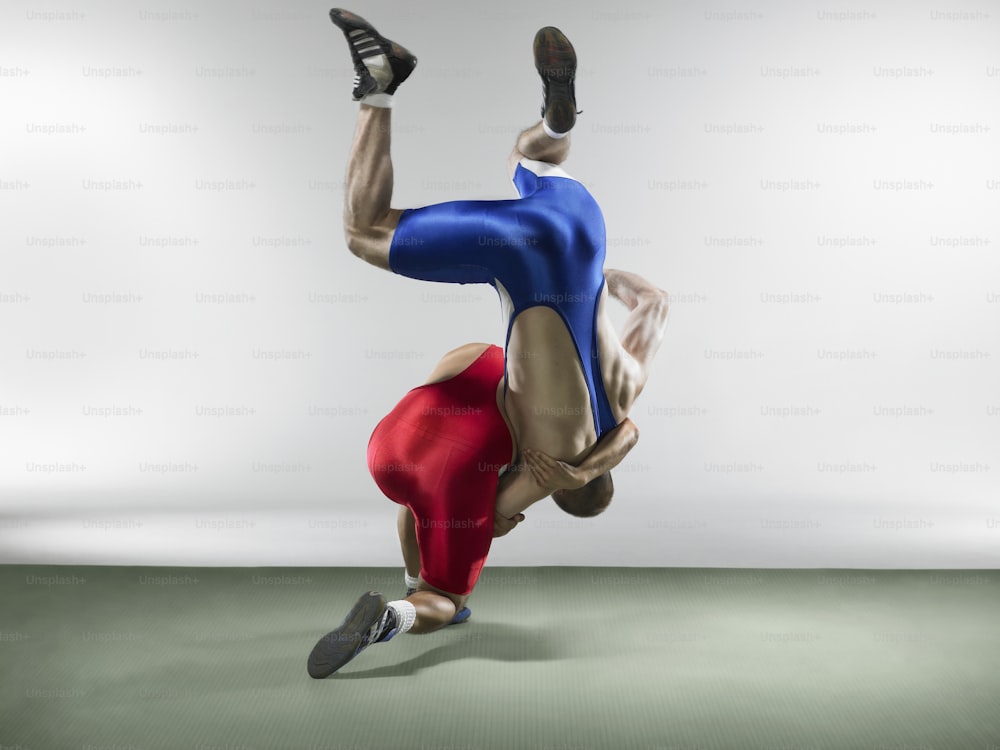 a man is doing a handstand on his feet