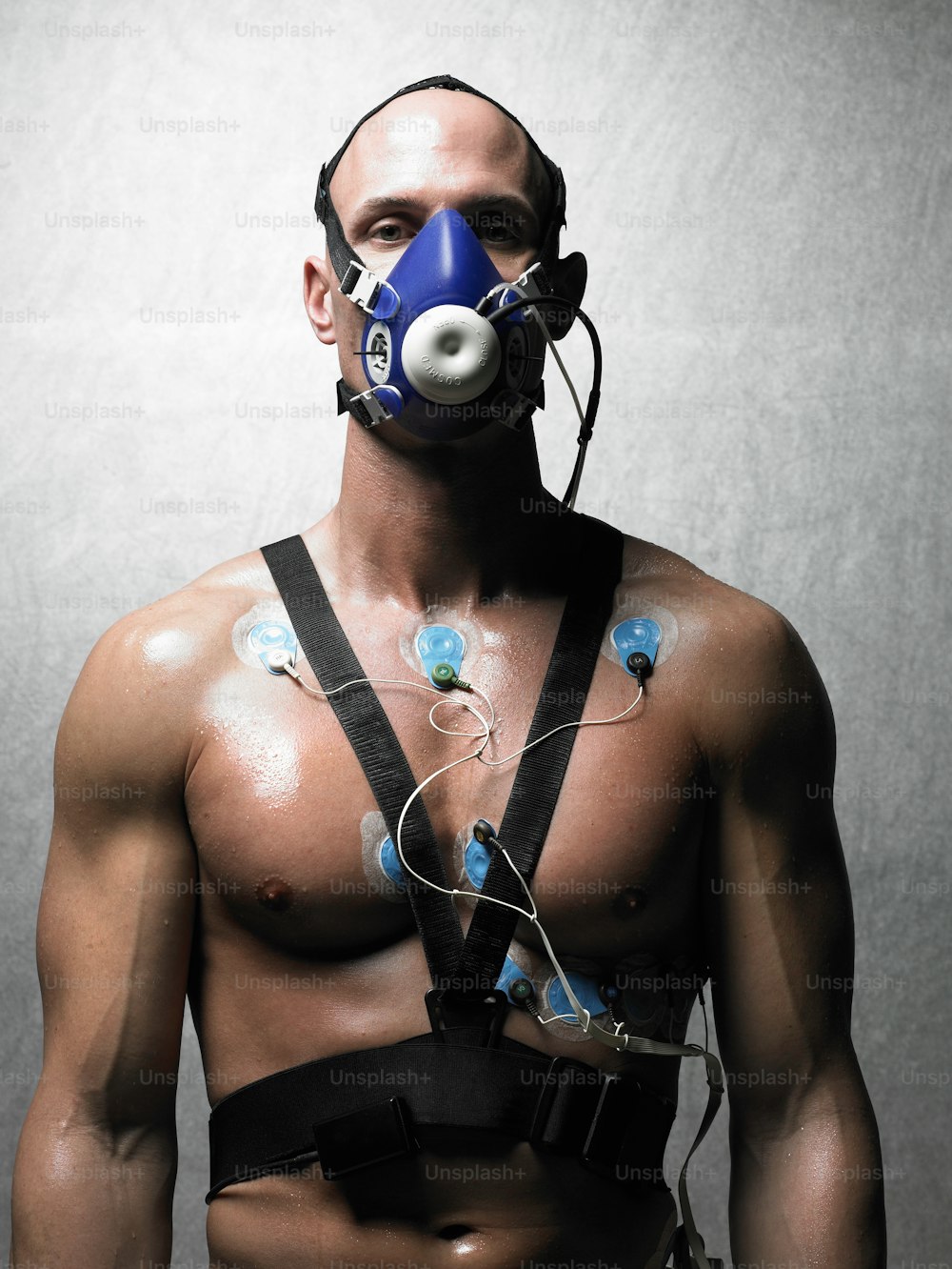 a man wearing a gas mask and harness